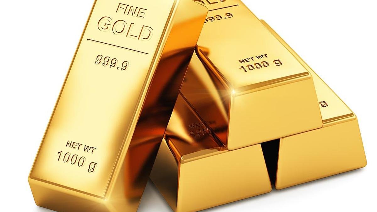 Gold ornaments and bullion displayed in a jewelry showroom as gold prices rise across India.