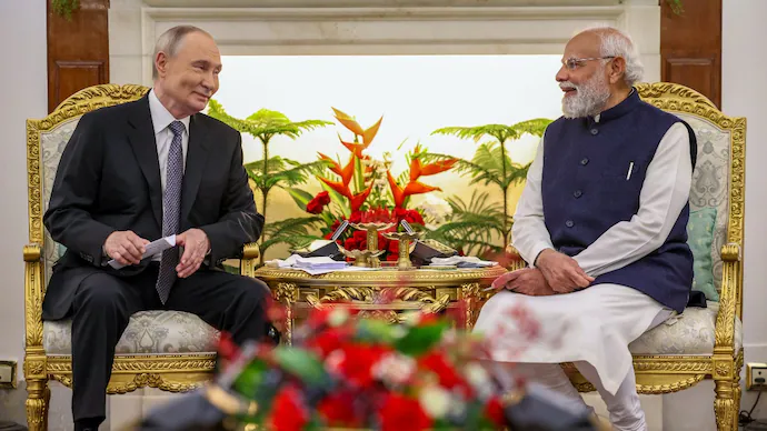 Indian and Russian officials discussing economic, technology, and energy cooperation during a bilateral meeting